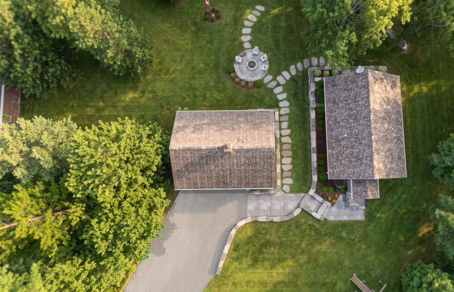 Aerial of fire circle, planting, and lake edge